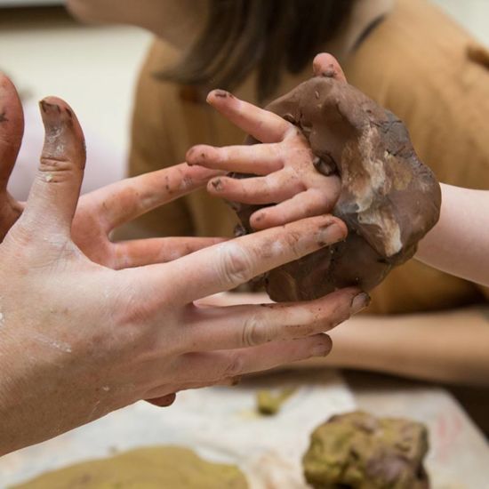 hands in modeling clay