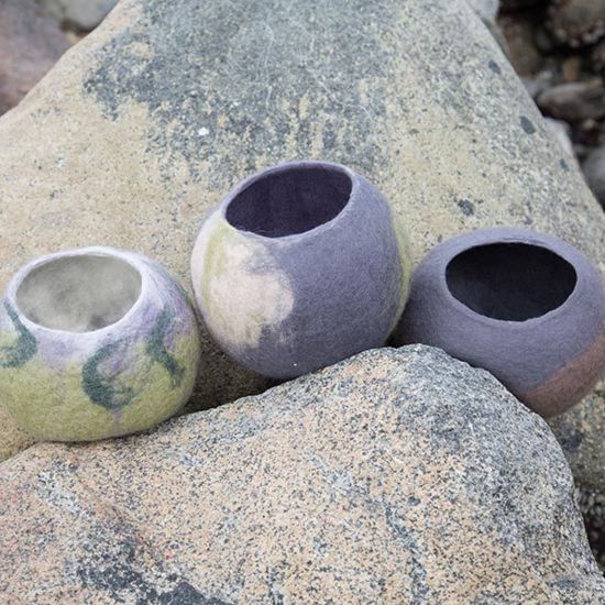 pottery bowls on rocks